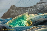 Light show in one of the icebergs in the glacial lake Jökullsarlon