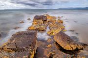 Strongly eroded (geological) dike at the west coast of the isle of Arran